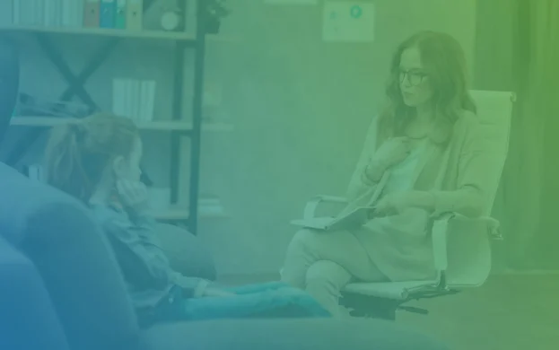 Psychiatrist talking to a patient in her office